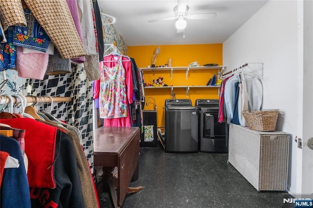 storage area with ceiling fan and washing machine and dryer