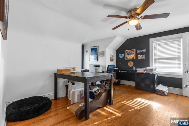 office area with lofted ceiling, wood finished floors, a ceiling fan, and baseboards