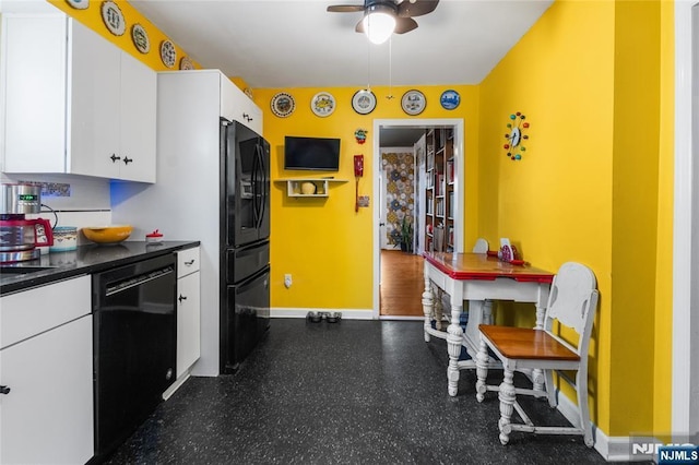 kitchen featuring baseboards, dark countertops, ceiling fan, black appliances, and white cabinetry