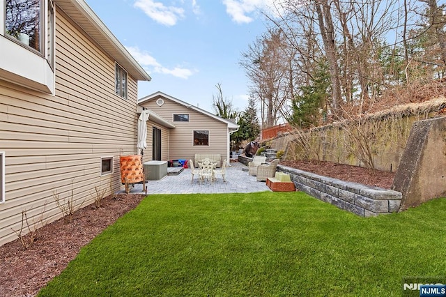 view of yard featuring a patio area and a fenced backyard