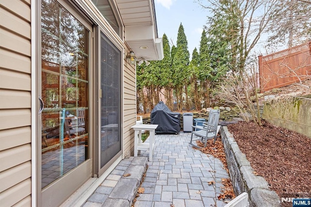 view of patio with a fenced backyard and area for grilling