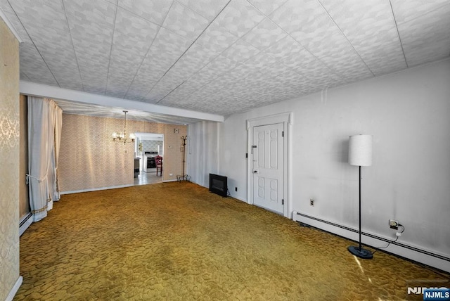 unfurnished living room featuring carpet, baseboard heating, and an inviting chandelier