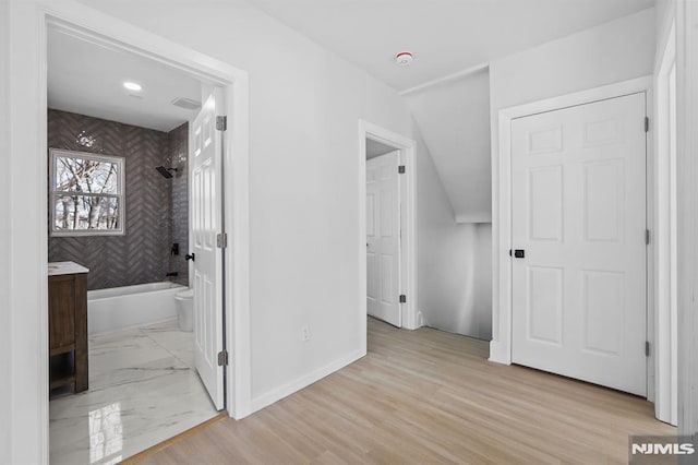 interior space with marble finish floor and baseboards