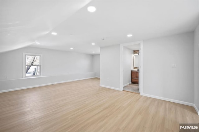 interior space featuring light wood finished floors, recessed lighting, and baseboards