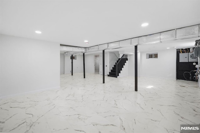 finished basement featuring stairs, recessed lighting, and baseboards