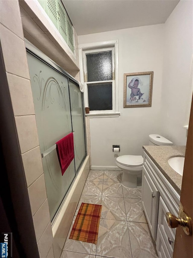 bathroom featuring toilet, visible vents, and vanity