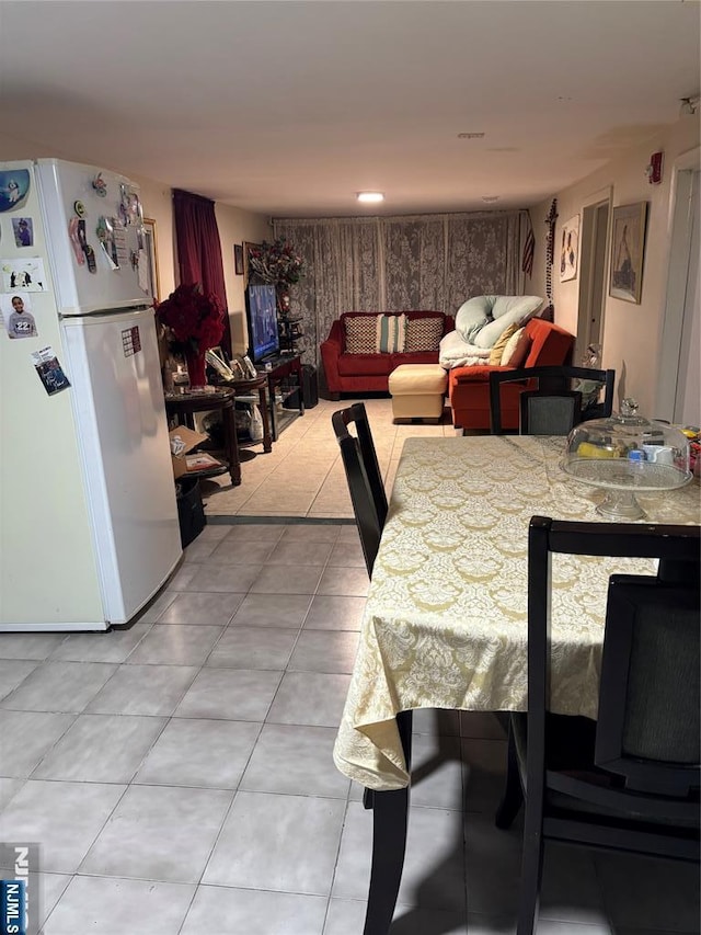 dining room featuring light tile patterned flooring