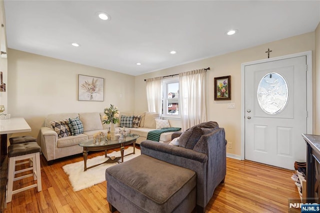 living room featuring recessed lighting and light wood finished floors