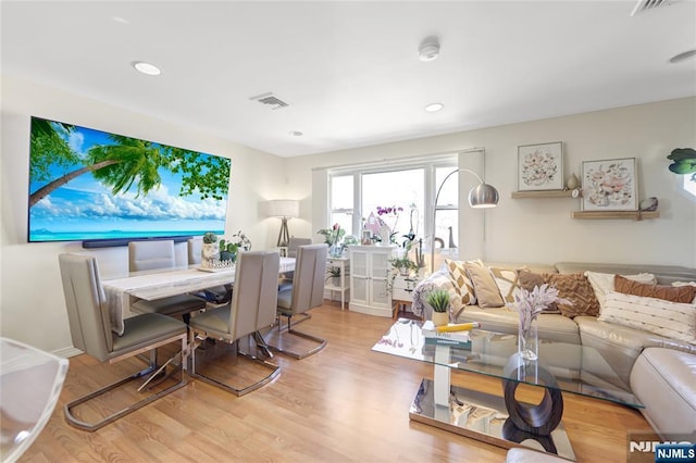 interior space featuring recessed lighting, visible vents, and light wood finished floors