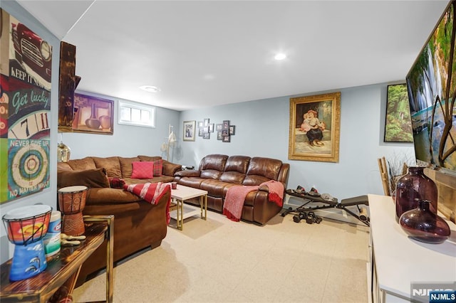 living area with recessed lighting and tile patterned floors