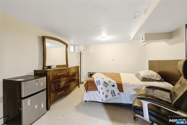 bedroom featuring light floors