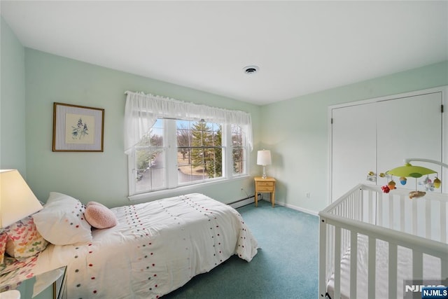 carpeted bedroom with a baseboard radiator, visible vents, and baseboards