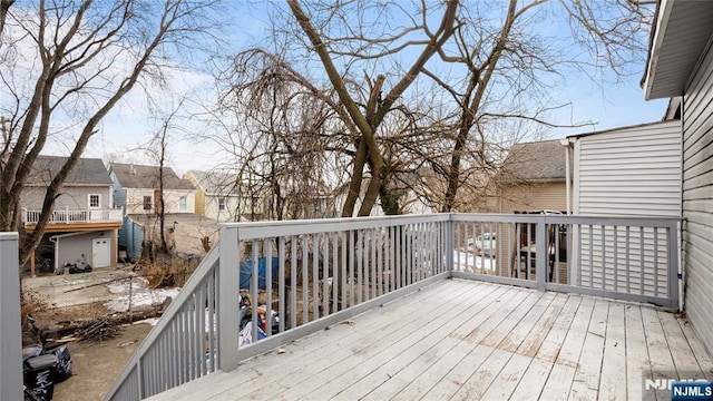 wooden deck with a residential view