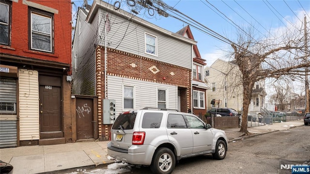 view of property with brick siding