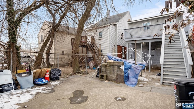 exterior space with stairway and fence