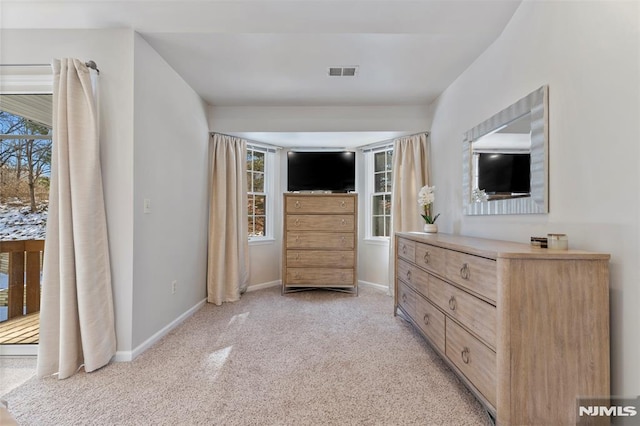 bedroom featuring baseboards and visible vents