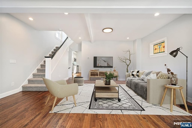 living room featuring recessed lighting, baseboards, stairway, light wood-type flooring, and beamed ceiling