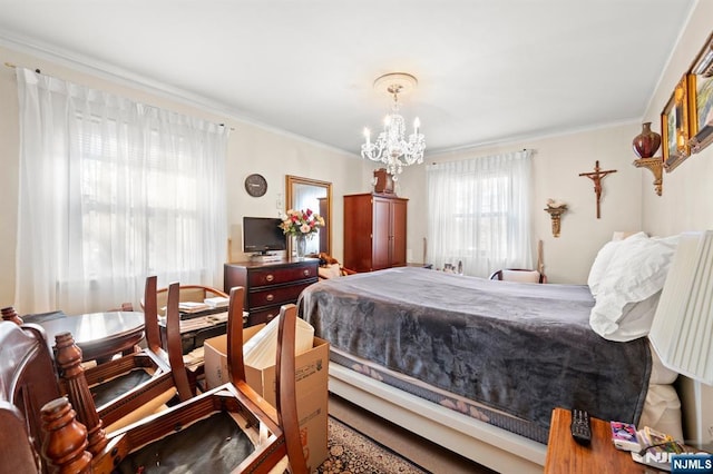 bedroom featuring an inviting chandelier and crown molding