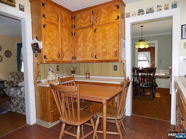 dining room with brick floor and crown molding