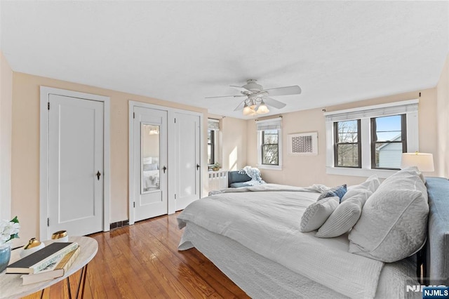 bedroom featuring a ceiling fan and wood finished floors