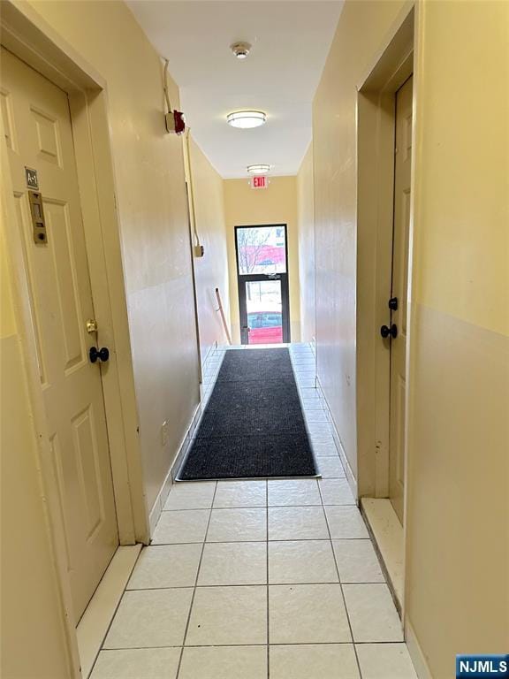 hallway with light tile patterned floors