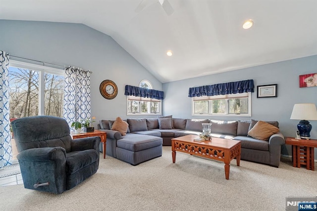 living room with high vaulted ceiling, recessed lighting, and carpet flooring