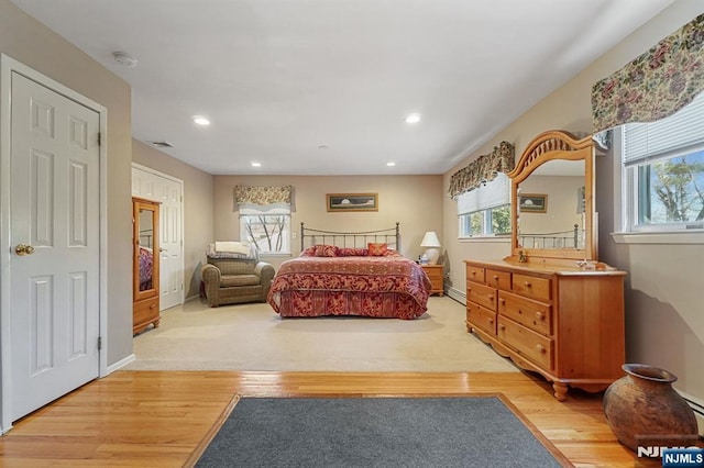 bedroom featuring recessed lighting, baseboards, visible vents, and light wood finished floors