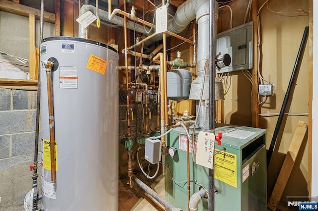 utility room with gas water heater and a heating unit