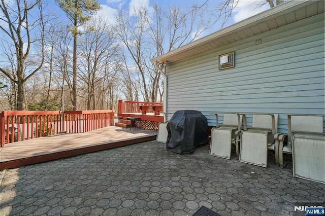 wooden deck with area for grilling