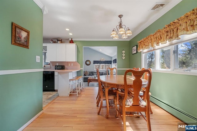 dining space with light wood-type flooring, a baseboard radiator, visible vents, and an inviting chandelier