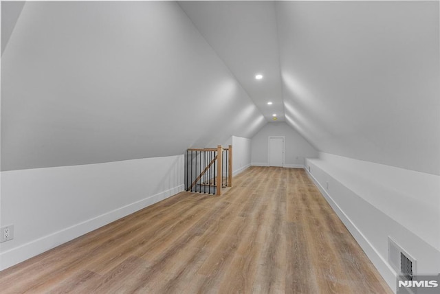 bonus room with recessed lighting, visible vents, baseboards, vaulted ceiling, and light wood finished floors