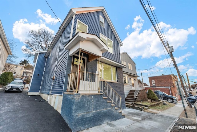 view of front of home with brick siding