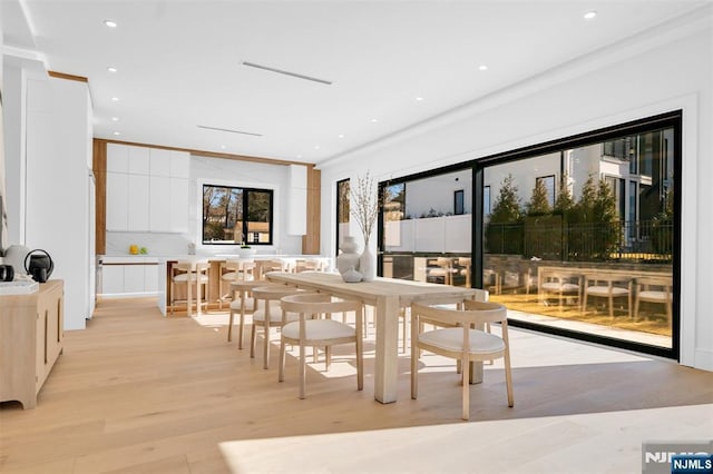 dining area with recessed lighting and light wood-style flooring