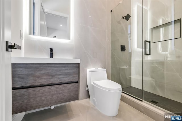 bathroom featuring vanity, toilet, and a stall shower