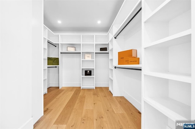 walk in closet featuring light wood-style floors