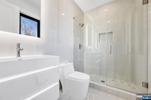 bathroom with toilet, tile walls, and a shower stall