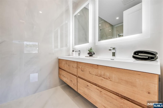 bathroom featuring double vanity and a sink