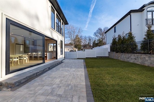 view of yard with a patio and fence