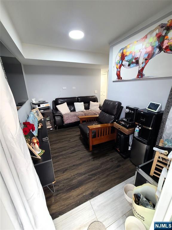 living room with dark wood-type flooring