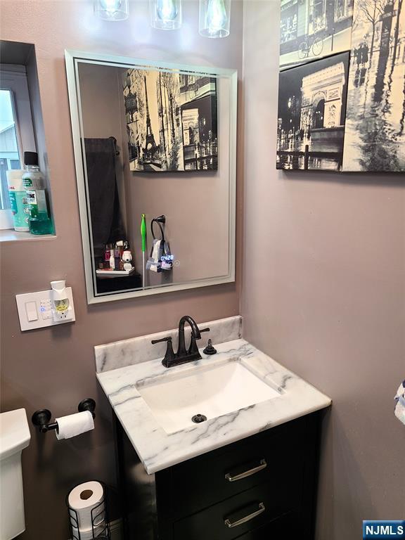 bathroom with vanity and toilet