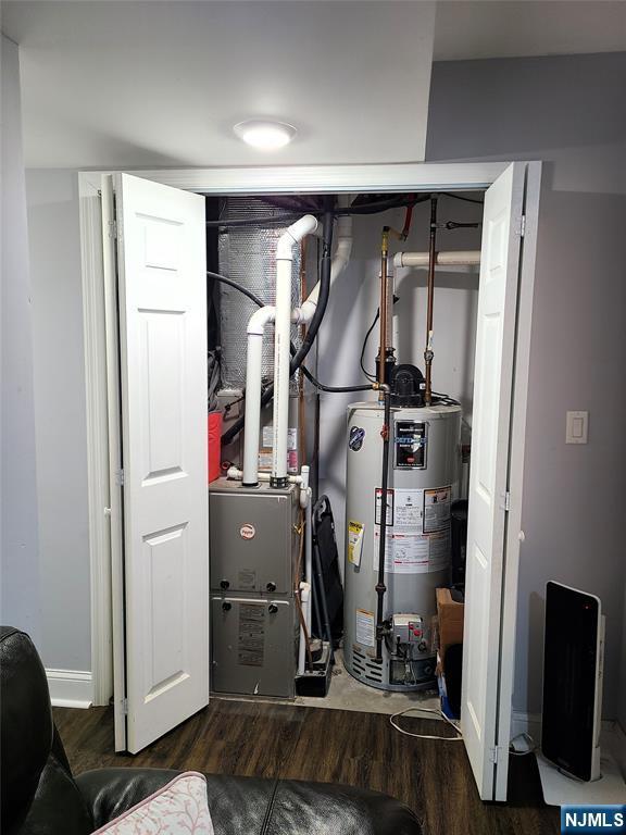 utility room featuring water heater