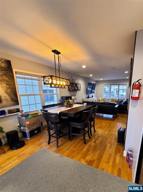 dining space featuring recessed lighting and light wood finished floors