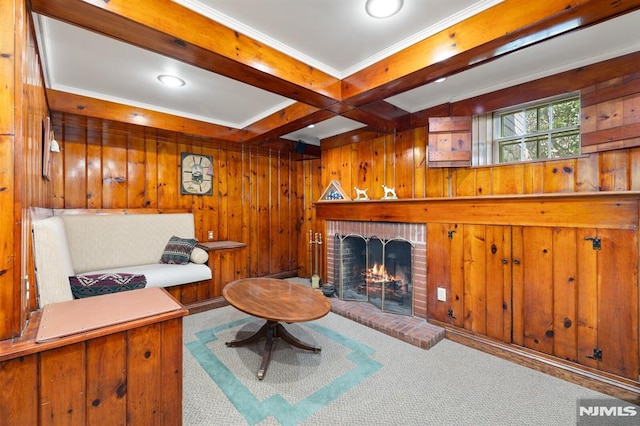 living room featuring a fireplace, carpet flooring, wood walls, and beam ceiling