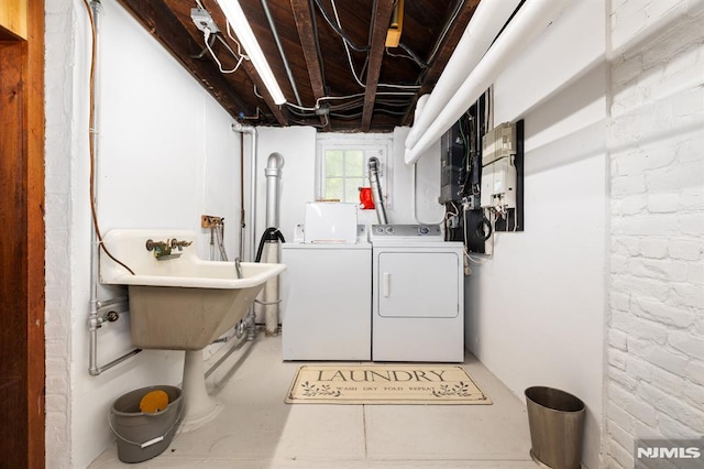 clothes washing area featuring laundry area and washer and dryer