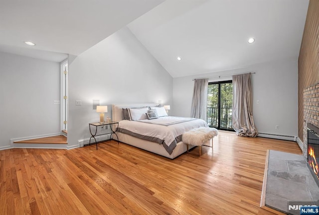 bedroom with a fireplace with flush hearth, light wood-style flooring, access to exterior, baseboard heating, and recessed lighting