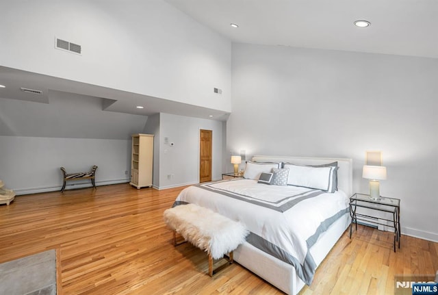 bedroom with recessed lighting, baseboards, visible vents, and light wood finished floors