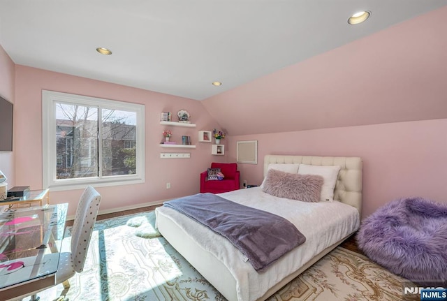 bedroom featuring lofted ceiling and recessed lighting