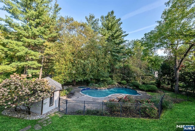 view of swimming pool with a fenced in pool, a patio area, fence, and an in ground hot tub