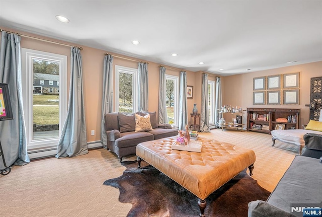 living room with light carpet, plenty of natural light, a baseboard radiator, and recessed lighting