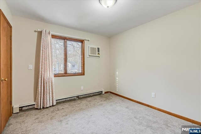 empty room featuring a baseboard heating unit, carpet floors, a wall mounted air conditioner, and baseboards